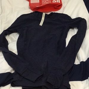 Lululemon shirt size 2. Comes with lululemon bag